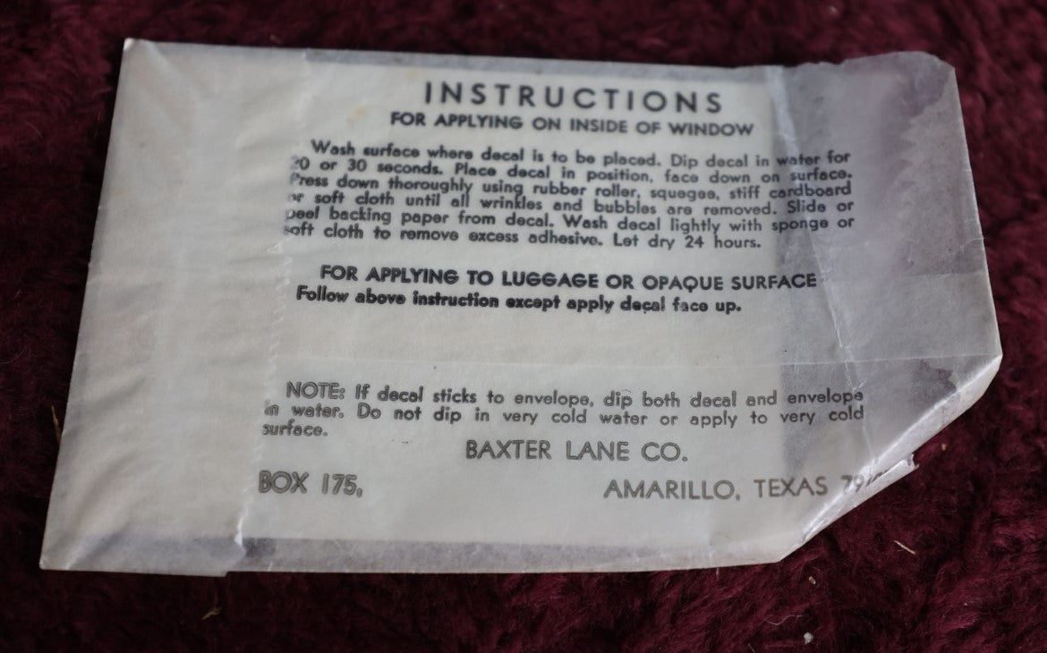 Lot 102 - Vintage Skull Jolly Roger Flag Window Or Luggage Aplique, By Baxter Lane Co., Amarillo, Texas