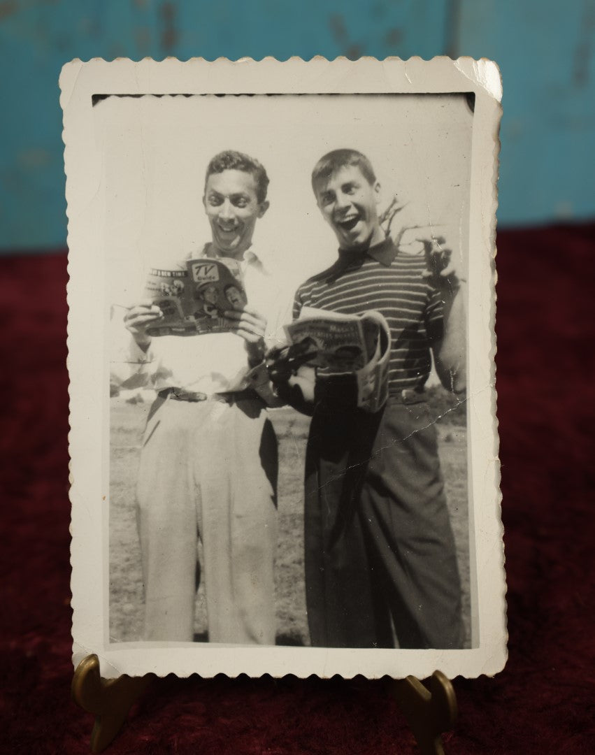 Lot 167 - Single Snapshot Photo - Boys Goofing Off, Reading Tv Guide