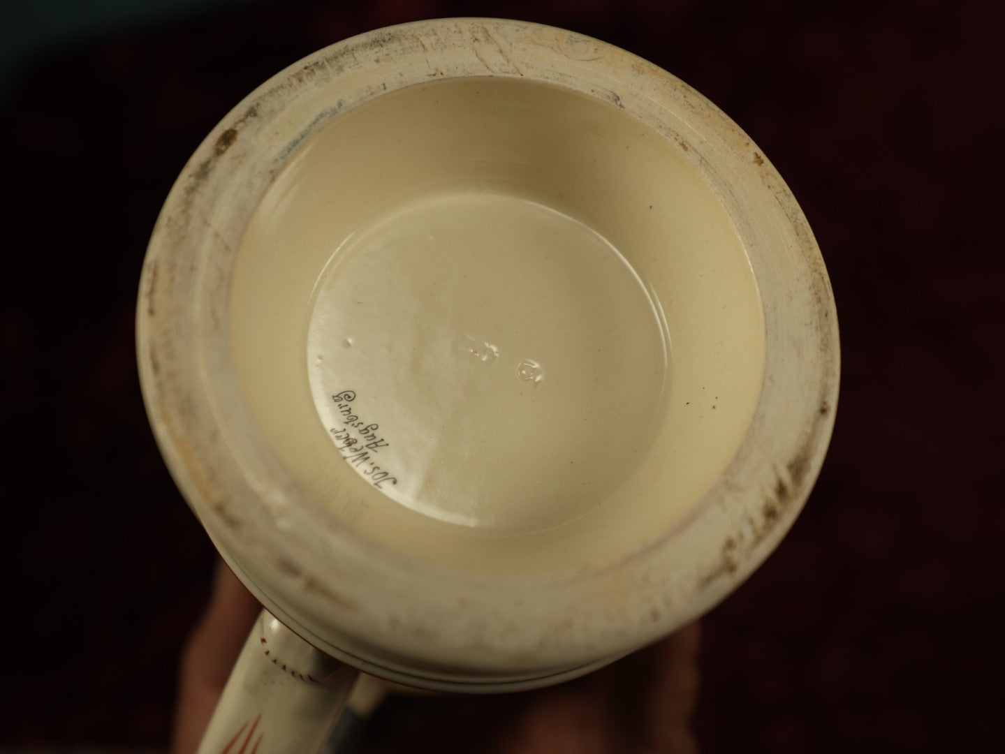 Lot 027 - Antique 1905 German Stein Having To Do With A Social Club, Featuring Winged Bat-Like Woman, Face Impaled Through Eye Ball, Augsburg Coat Of Arms, Signed Jos. (Joseph) Weber, Augsburg, With Markings