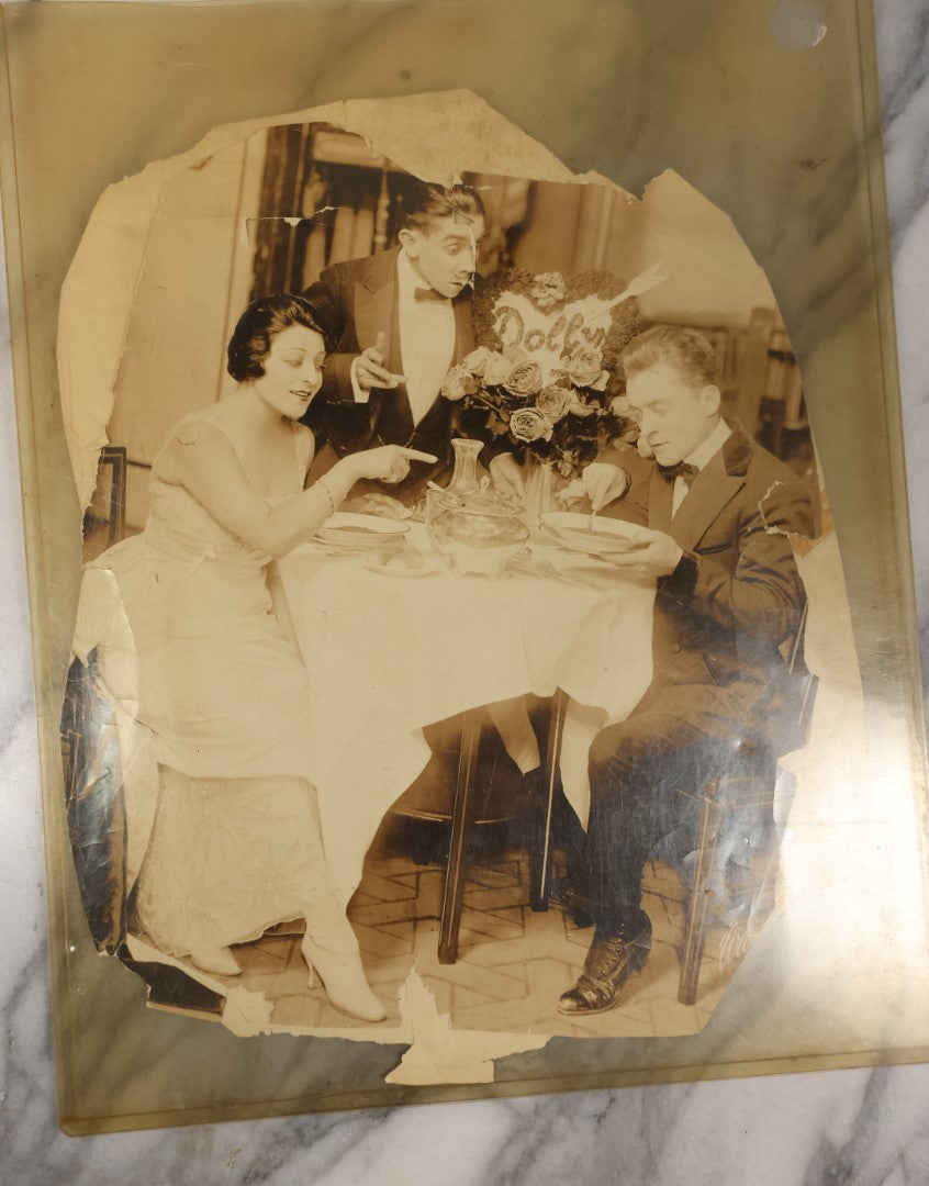 Lot 110 - Pair Of Poor Condition Large Size Vaudeville Era Promo Photos, With "Dolly" Floral Arrangement, Unknown Origin, Very Damaged, Worn