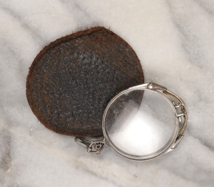 Lot 148 - Single Junk Drawer Finding, Spring Loaded Fold Up Eye Glasses With Case, Note Case Split