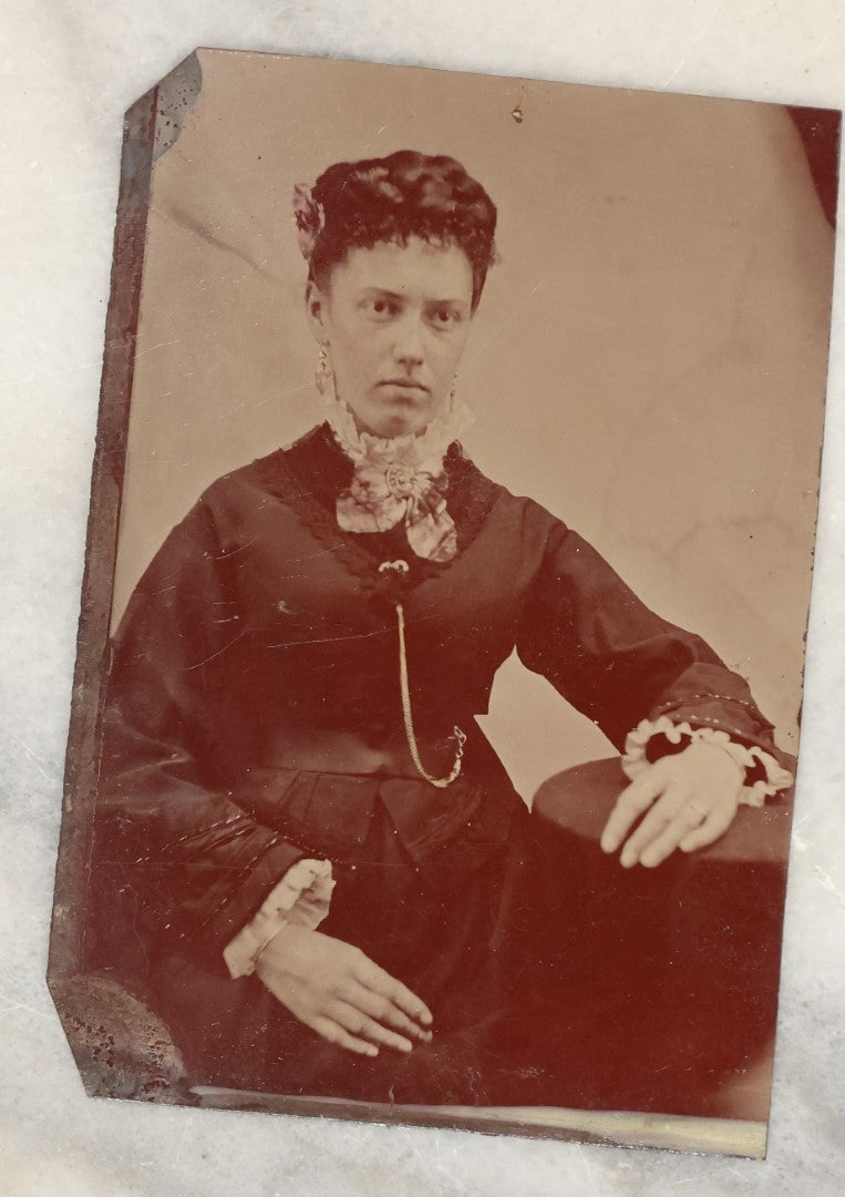 Lot 135 - Grouping Of Six Antique Tintype Photographs Of Pretty Young Women, Including Smiling Woman With Tinted Bow Holding Photo Album