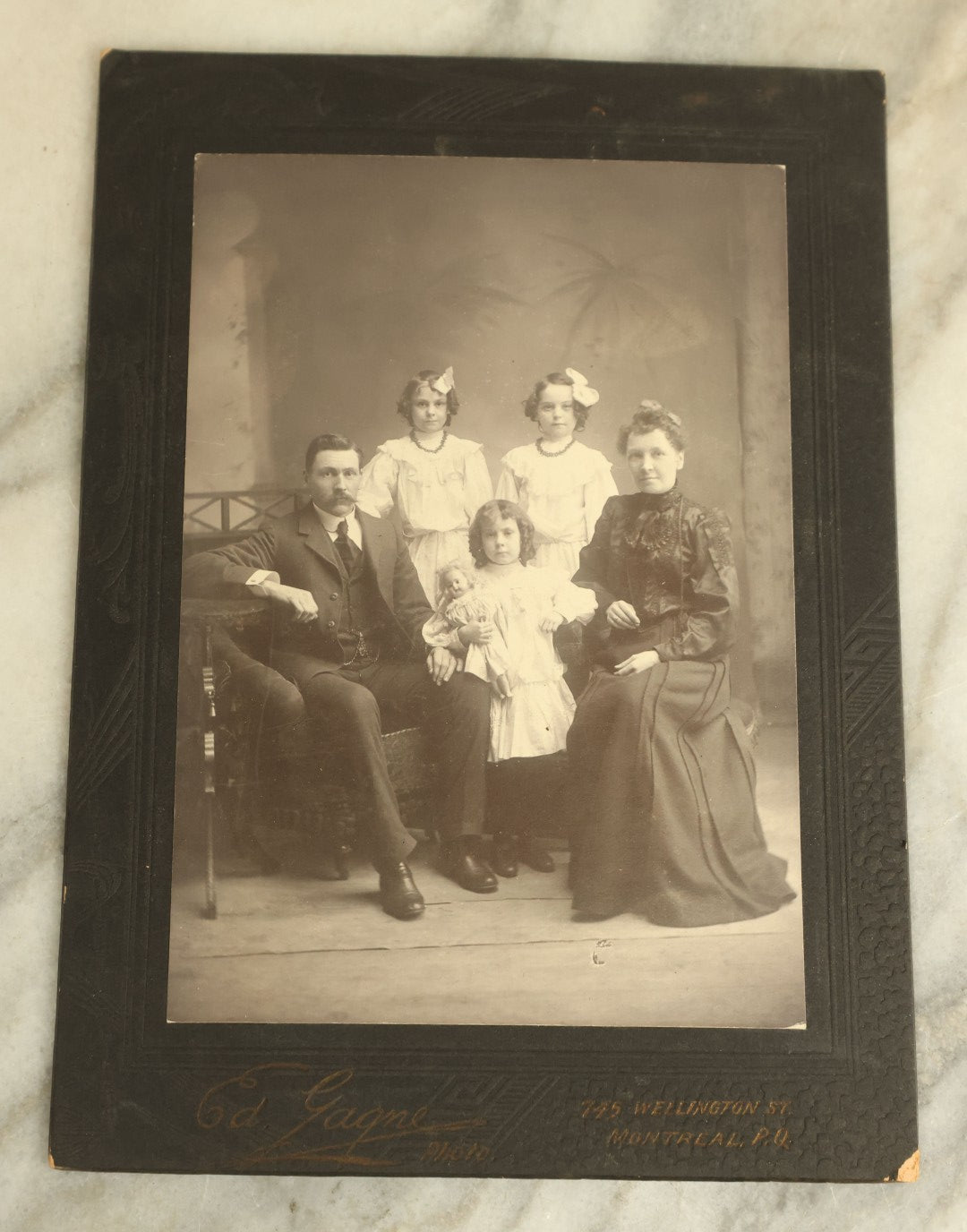 Lot 092 - Antique Boarded Photograph Of A Family, Including A Little Girl And Her Doll, And Apparent Twins, Ed Gagne, Photographer, Montreal, Canada