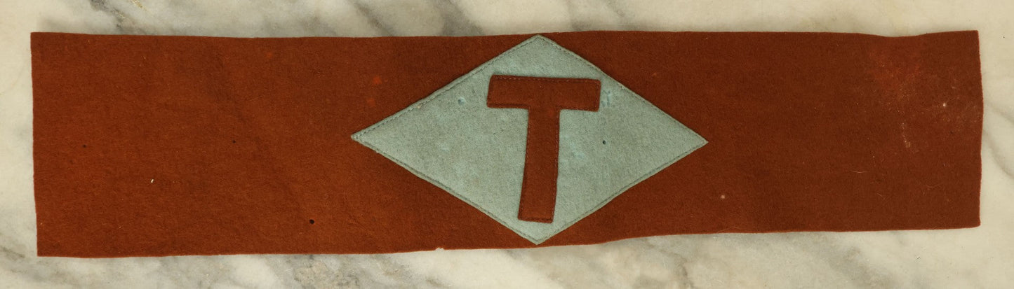 Lot 108 - Antique Reddish Felt Arm Band With Hand Sewn "T" Insignia