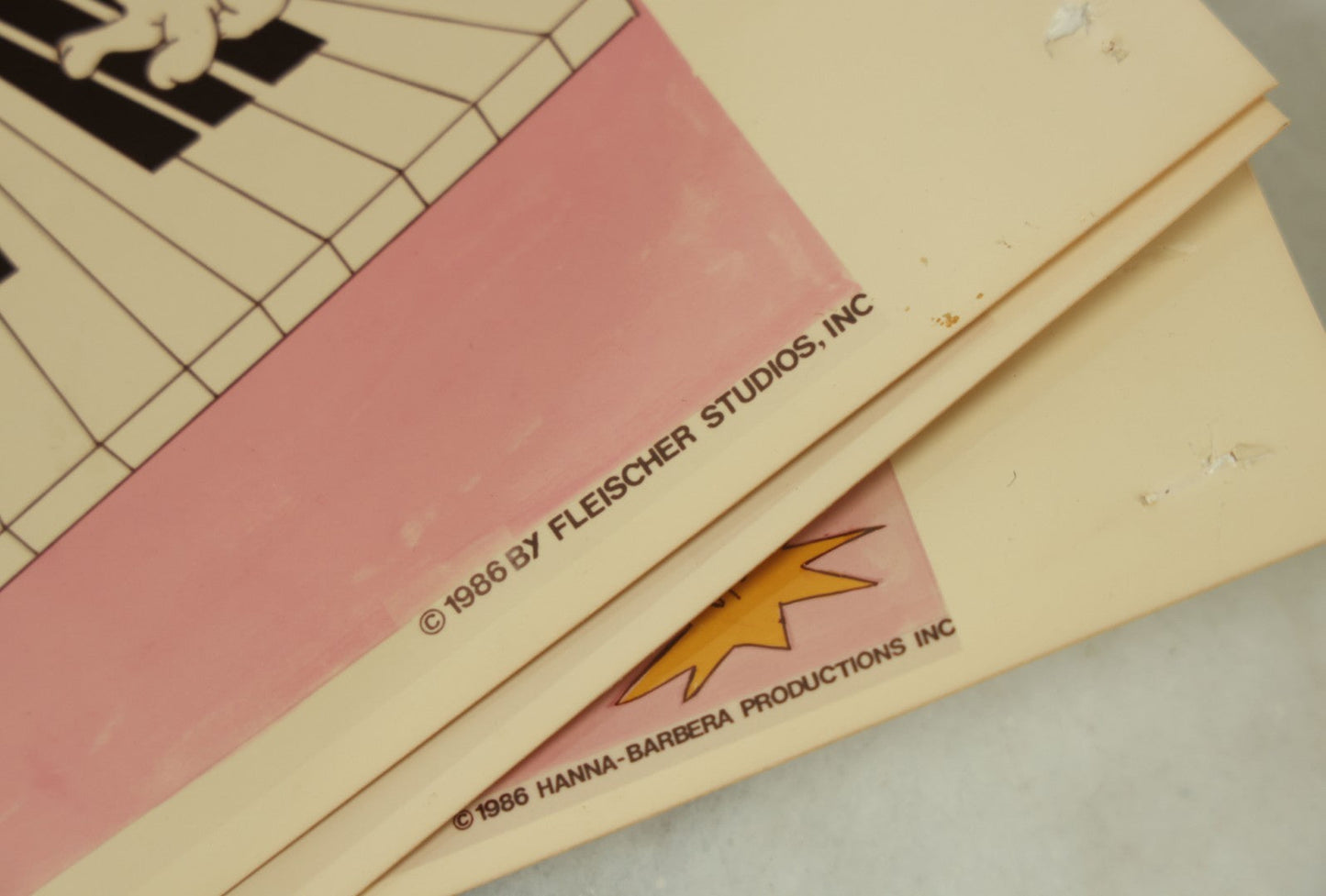 Lot 090 - Grouping Of Six Vintage Glossy Photos Of Cartoon Artwork Including Betty Boop, Pink Panther, Flintstones, And Gumby, 1980s, Hanna-Barbera, Fleischer Studios, Etc.