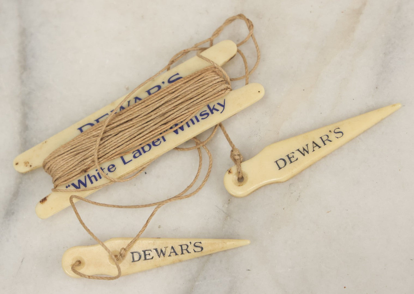 Lot 052 - Vintage Dewar’s White Label Whisky String Holder With Bone Tags, Advertising Collectible
