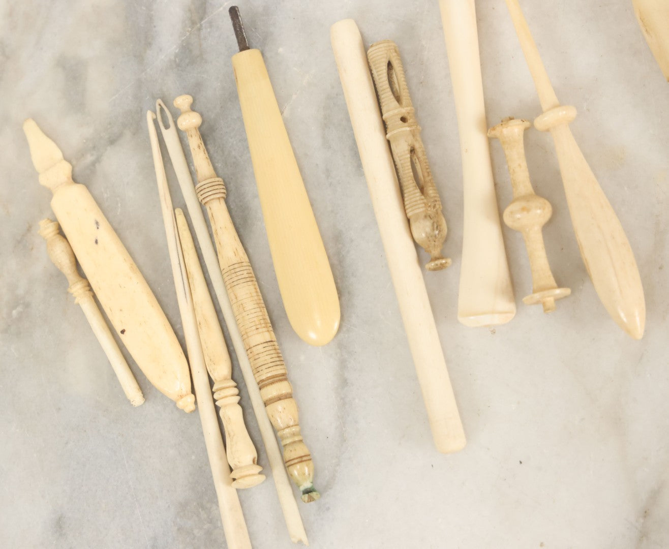 Lot 058 - Grouping Of Antique And Vintage Bone Crochet Hooks, Lace Bobbins, Sewing Tools, Implements, And Fragments, Various Sizes And Styles, Approximately 20 Pieces