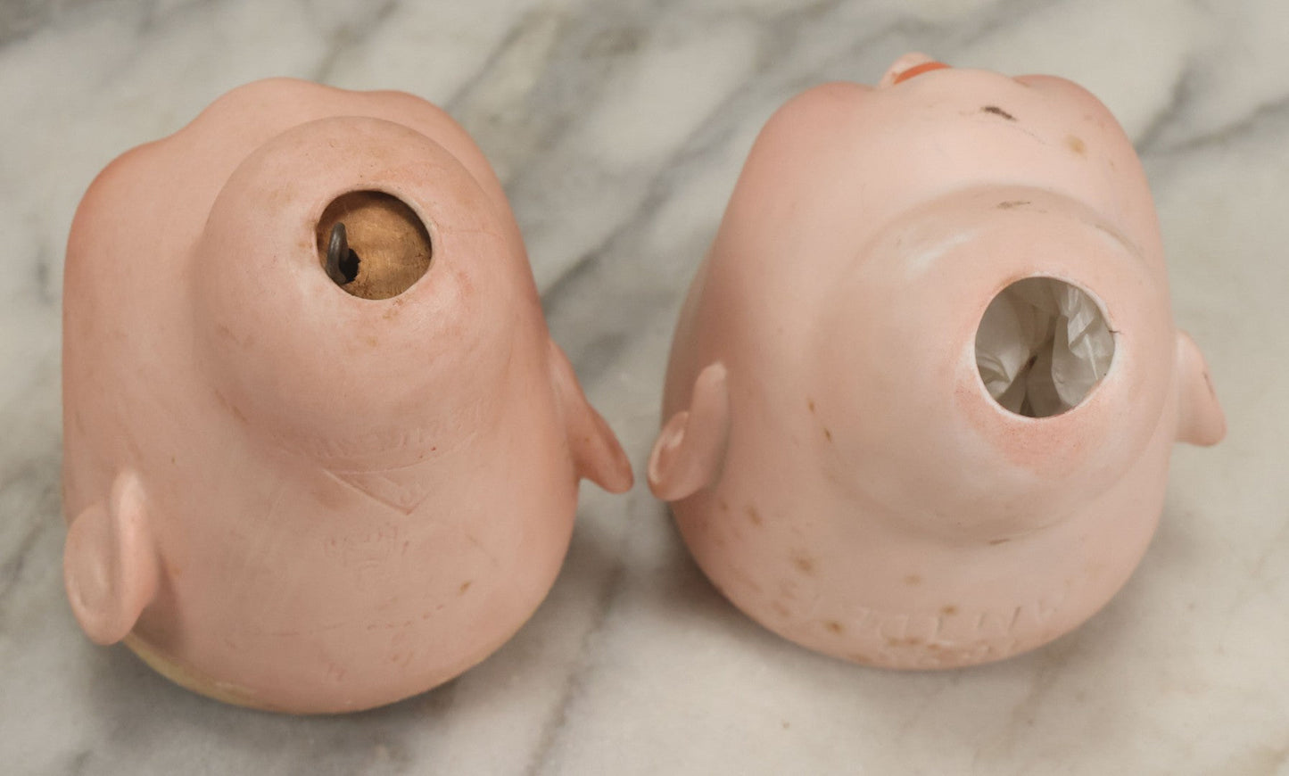 Lot 064 - Pair Of Antique Porcelain Doll Heads With Glass Eyes, Note Cracks, Missing Parts, And Age Wear, Armand Marseille 1894 & Limbach Wally