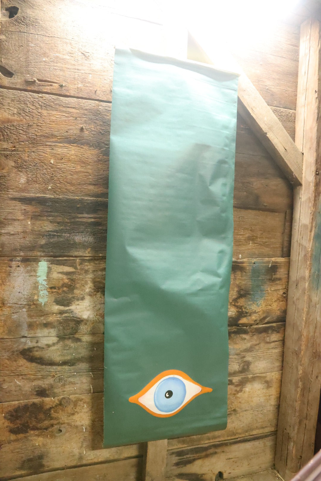 Lot 080 - Vintage Hand Painted Eyeball Art On Green Vinyl Window Blind, 26" Across x 73" Long Unrolled Including Hangers