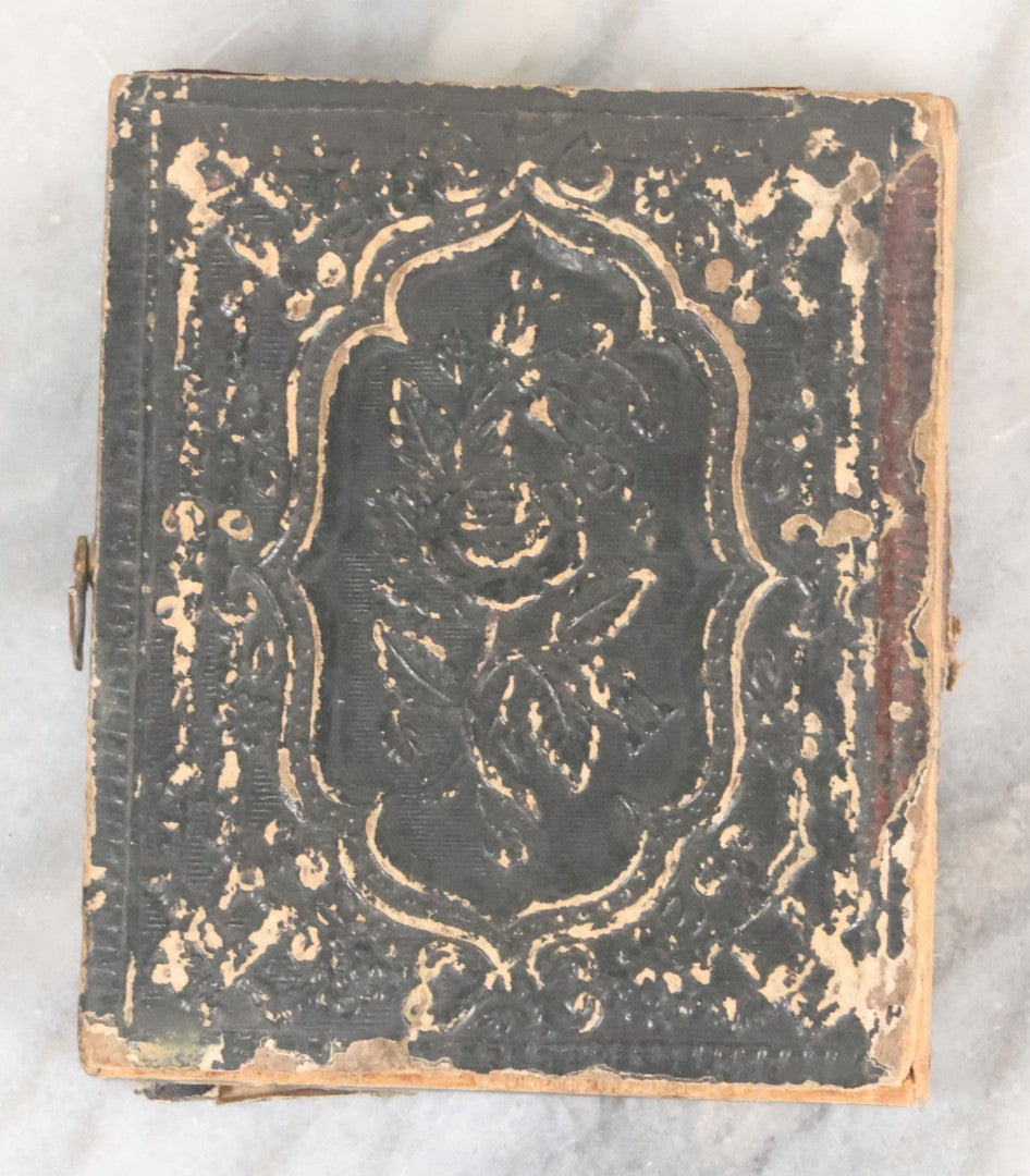 Lot 061 - Antique 1/9th Plate Ambrotype Photograph Of Young Woman, Appears To Have Been Defaced To Give Her A Beard And Other Comic Embellishments, Poor Condition, In Split Half Leatherette Union Case