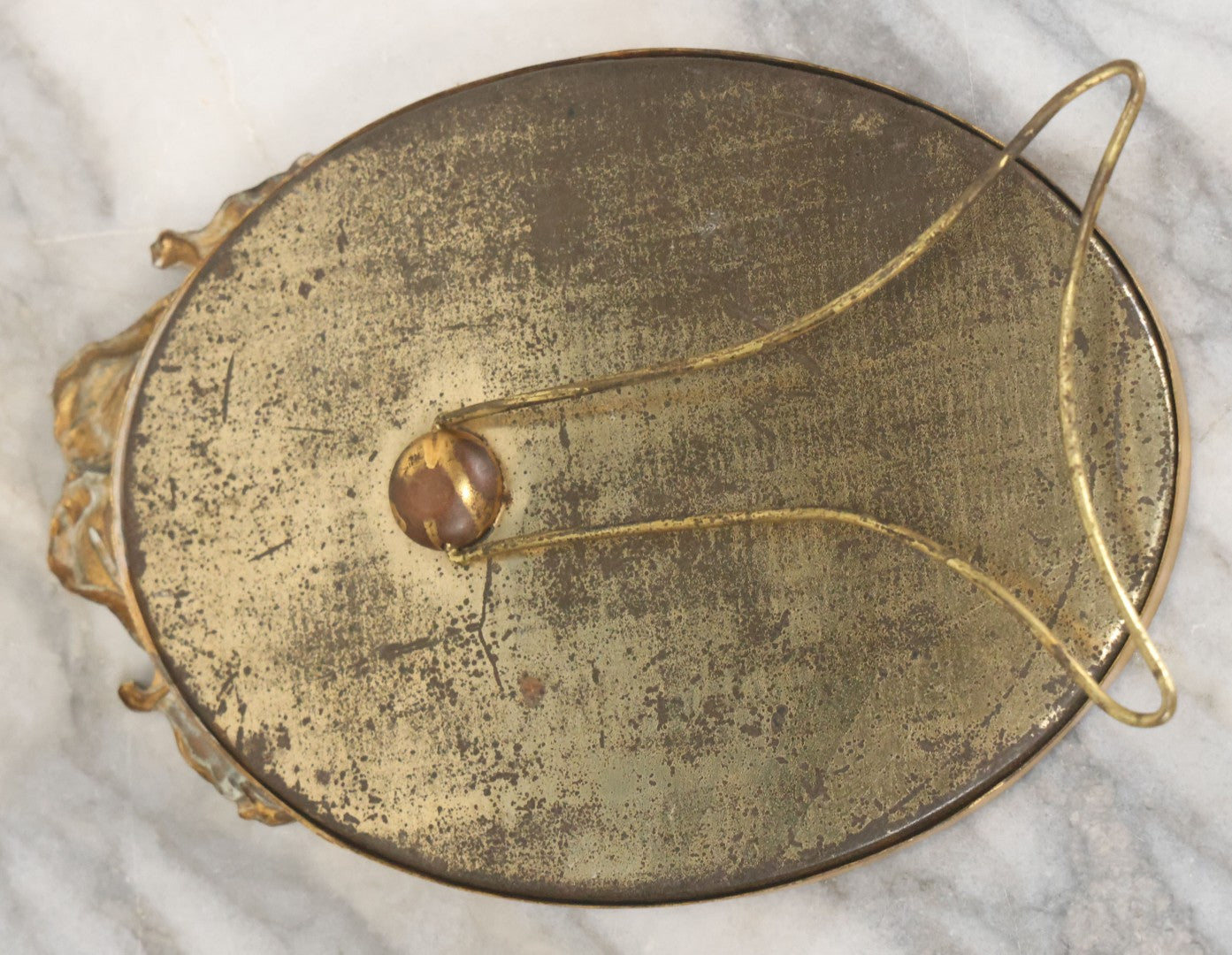 Lot 064 - Antique Oval Boarded Photograph Of Young Baby In White Gown In Brass Frame With Iris Flower Motif, 4-3/8" x 6-1/2"