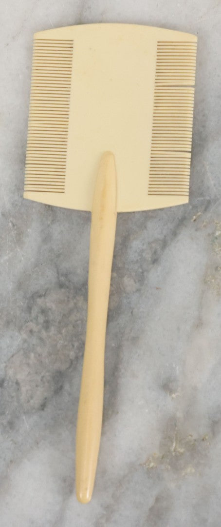 Lot 095 - Pair Of Antique Celluloid Dresser Items, Including Baby Comb With Painted Bluebird And Corset Hook