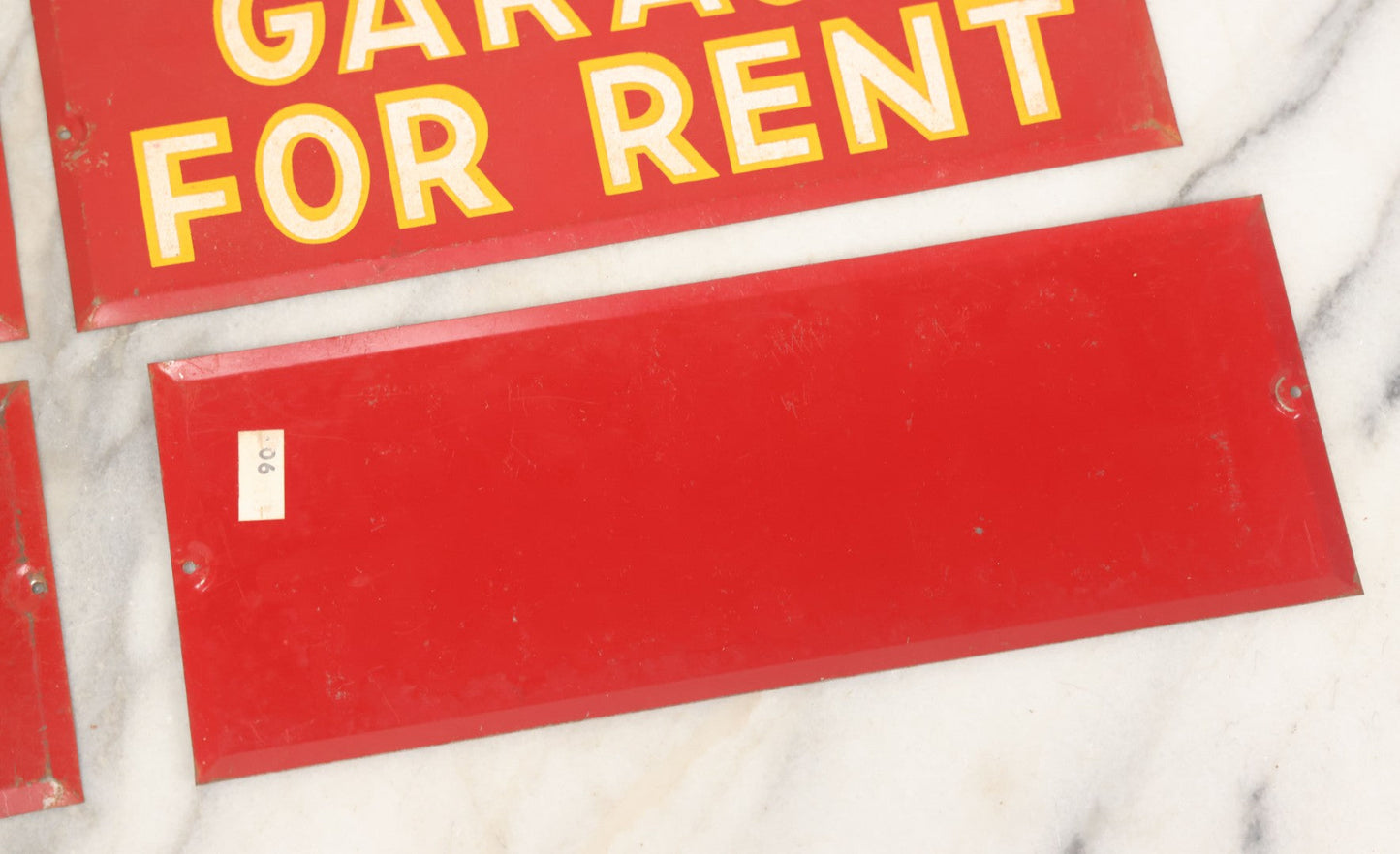 Lot 017 - Grouping Of Four Vintage Red "Garage For Rent" Tin Tacker Sign With Smaltz Lettering, White Letters With Yellow Outlines, 9-1/4" x 3-1/2"
