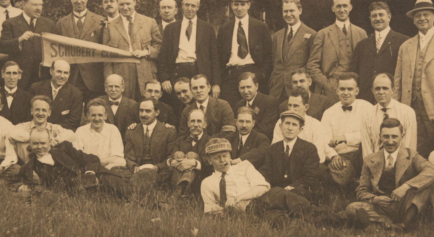 Lot 065 - Antique Boarded Photograph Of The Men Of The Schubert Club, Holding A Pennant, Man With Schubert Hat, Likely The Music Organization Of Saint Paul, Minnesota