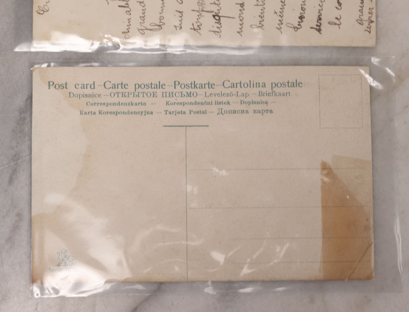 Lot 107 - Grouping Of Three Antique Foreign Postcards Of Children And Cherubs In Fantastical Scenes Including Flying On Birds, Napping On The Moon, And Sitting On Giant Mushrooms