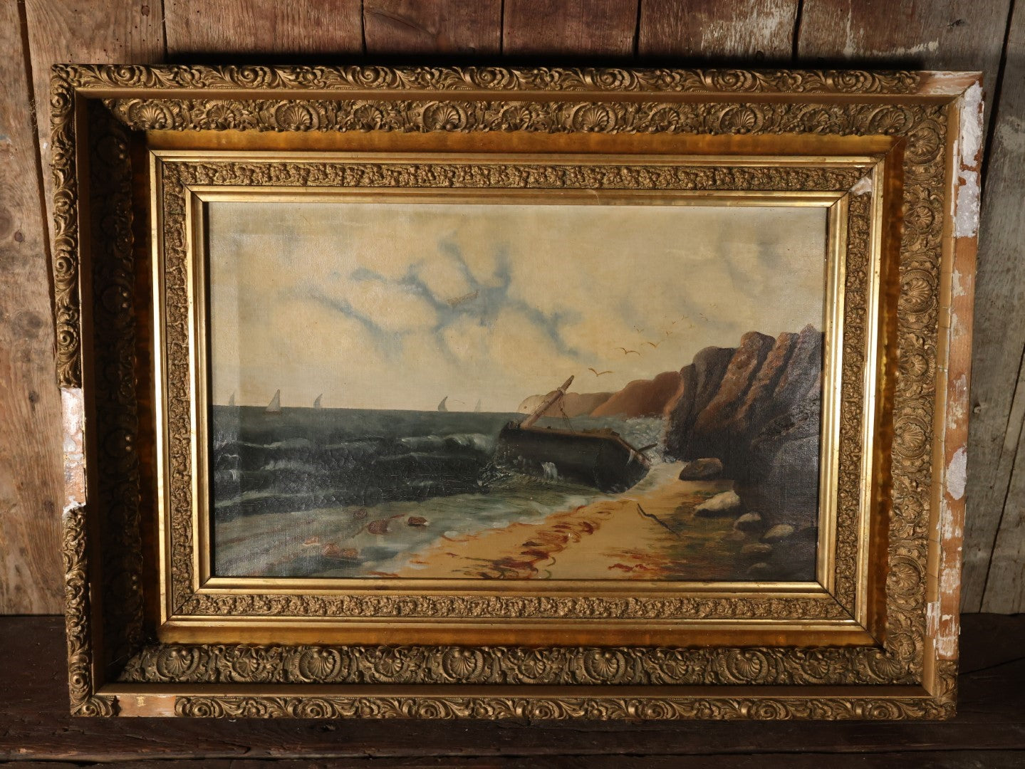 Antique Oil On Canvas Painting Of A Shipwreck Washed Up On The Beach With Sailboats And Seagulls In The Distance, Nautical Painting, In Deep Ornate Gilt Frame, Note Frame Damage