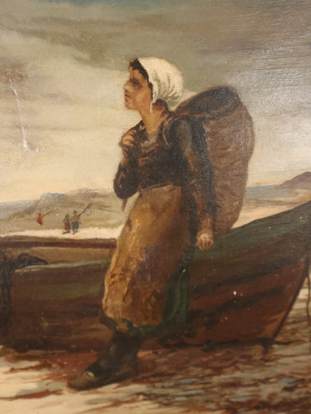 Antique Oil On Canvas Painting Of Young Woman Leaning Against Boat On The Beach With Basket On Back, White Hair Scarf, In Ornate Gilt Frame