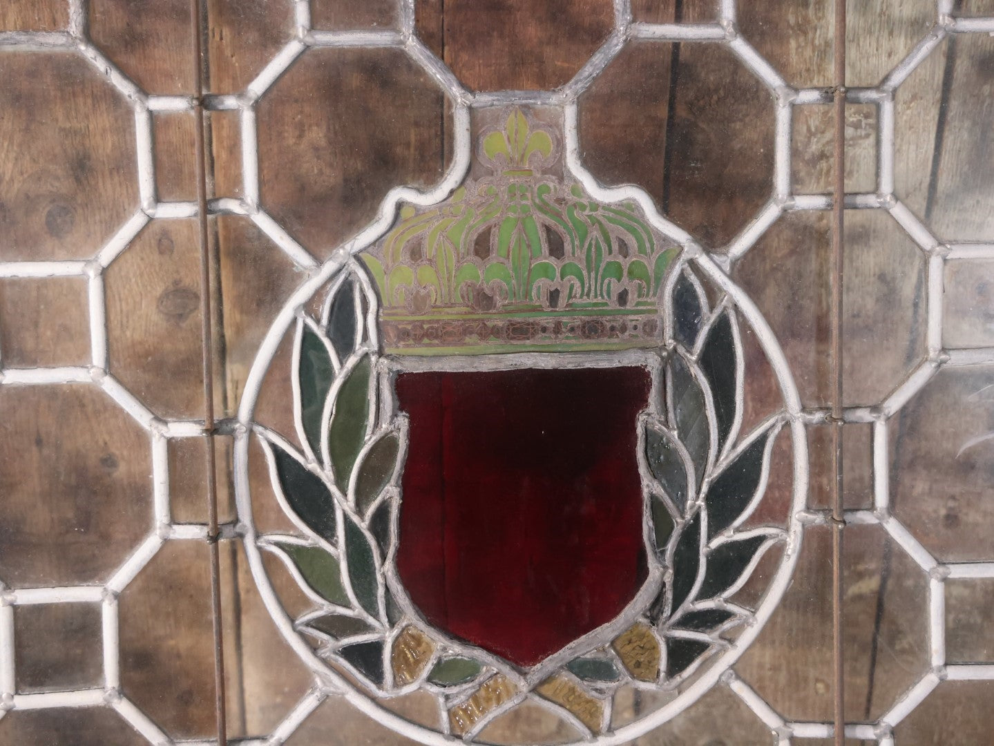 Antique Leaded Stained Glass Window With Red Shield At Center, Reinforced With Brackets, No Cracks, Ornate Green Panel, Wood Frame