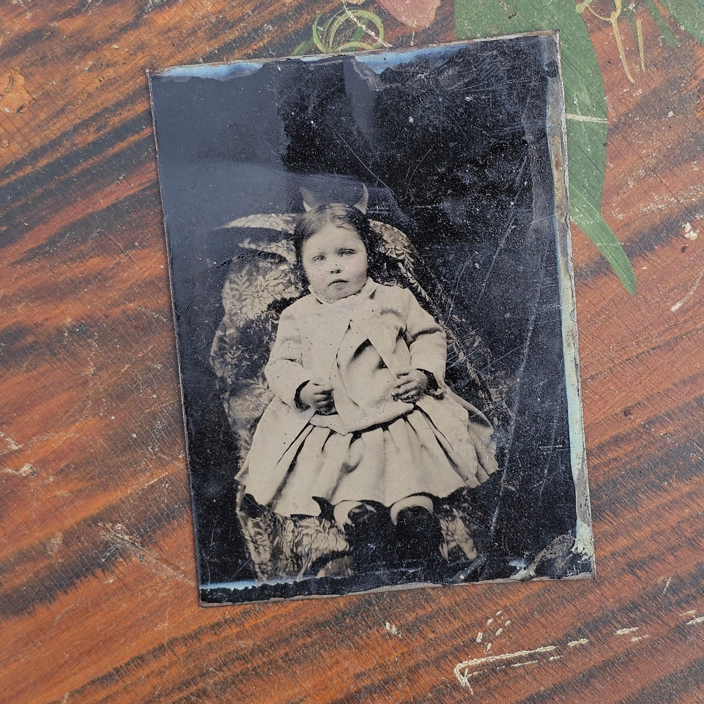 Hidden mother tintype photograph identified as Lillie Wilkinson