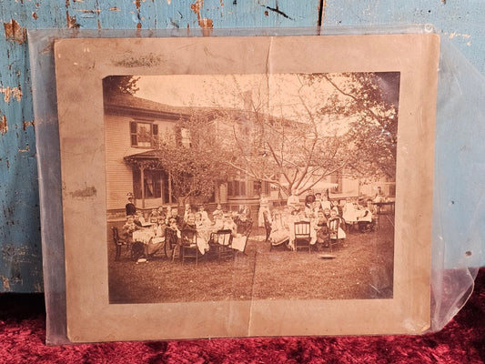 Boarded Exterior Photo Of Large Children'S Party, Crease/Rip Down Middle, Repaired With Cardboard Backing