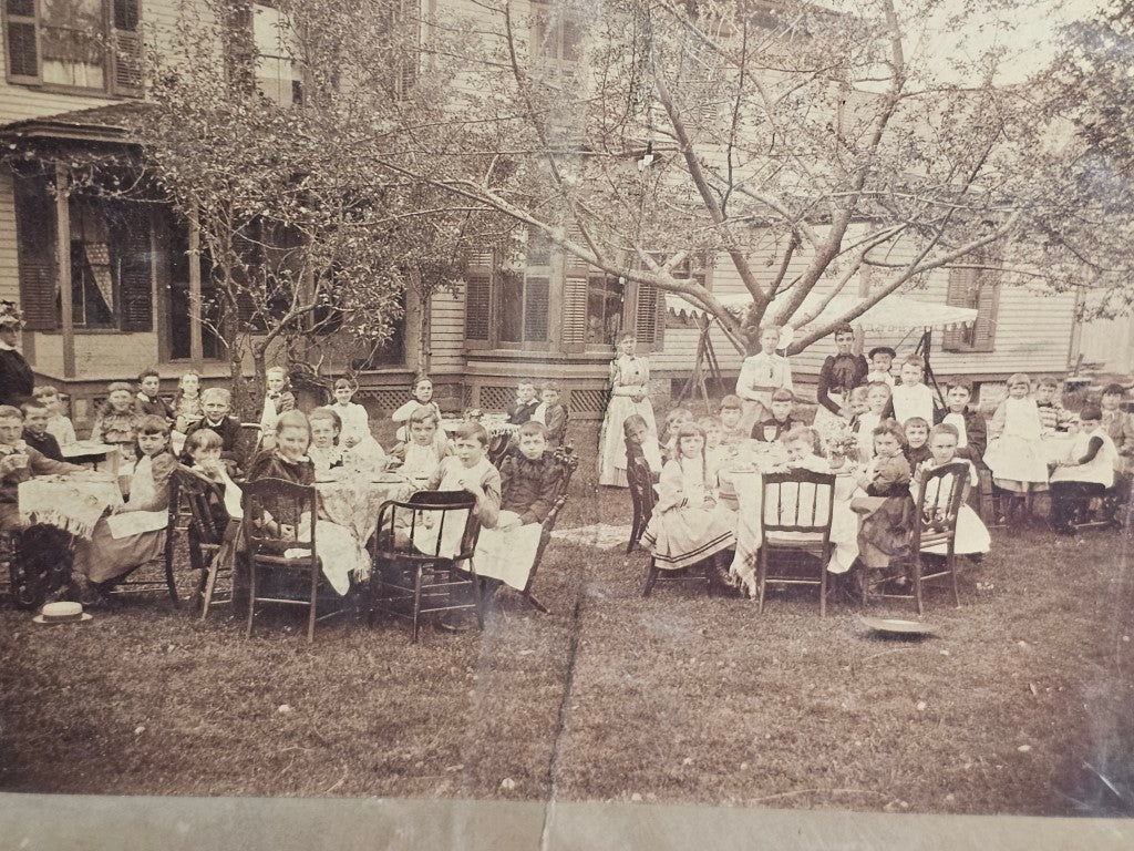 Boarded Exterior Photo Of Large Children'S Party, Crease/Rip Down Middle, Repaired With Cardboard Backing