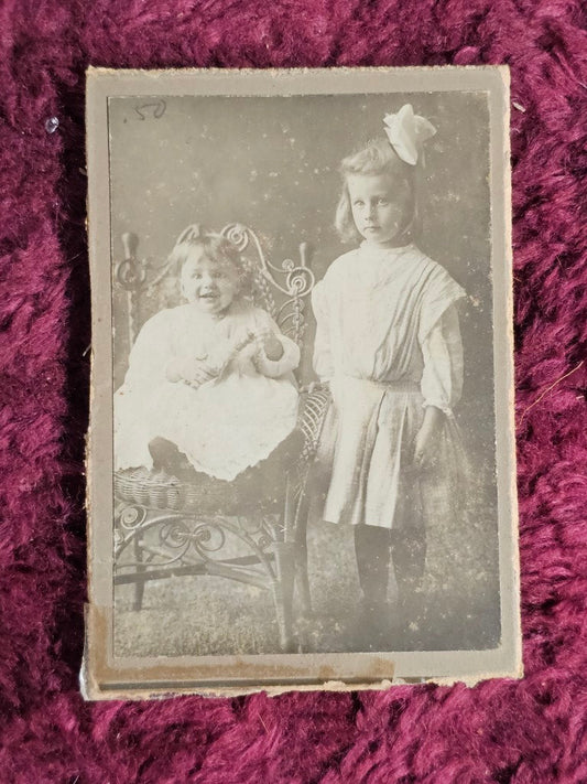 Trimmed Boarded Photo Of Two Girls, One With Doll