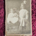 Lot 132 - Trimmed Boarded Photo Of Two Girls, One With Doll