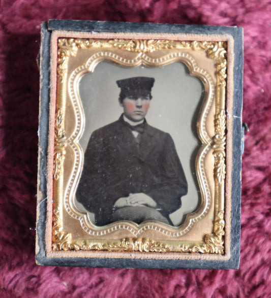 Lot 044 - Antique 9Th Plate Ambrotype Of Yound Man In Hat, Dark Clothes, Possible Occupational, In Half Leatherette Case