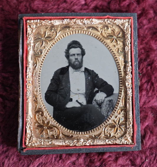 Lot 045 - Antique 6Th Plate Ambrotype Photograph Of Middle Aged Man, Disheveled Hair, Beard, Gold Tinting On Watch Chain, In Half Leatherette Case