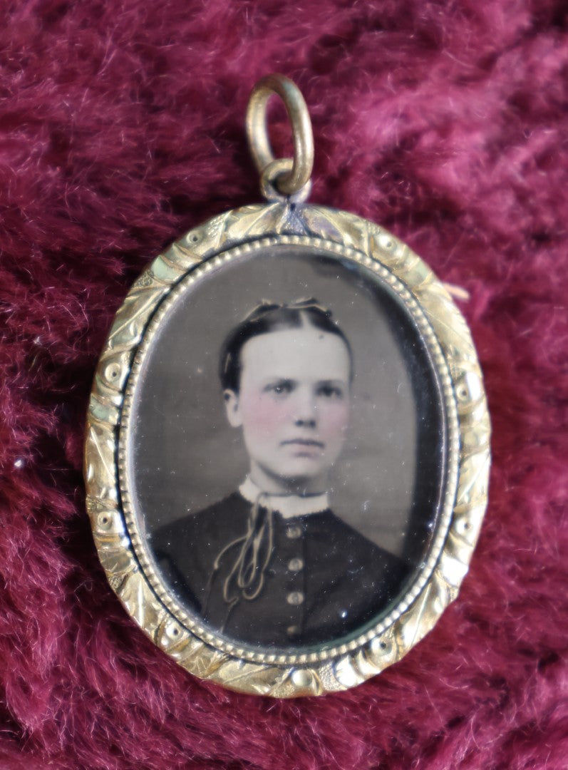 Lot 058 - Pair Of Antique Gold Toned Pendants With Tintype Photos, Man And Woman