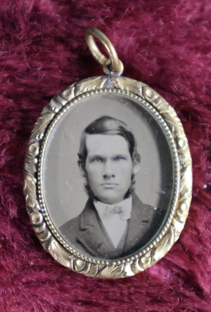 Lot 058 - Pair Of Antique Gold Toned Pendants With Tintype Photos, Man And Woman