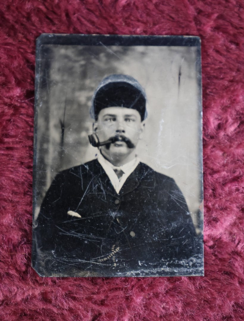 Lot 097 - Tintype Of Man In Russian Hat Smoking Pipe