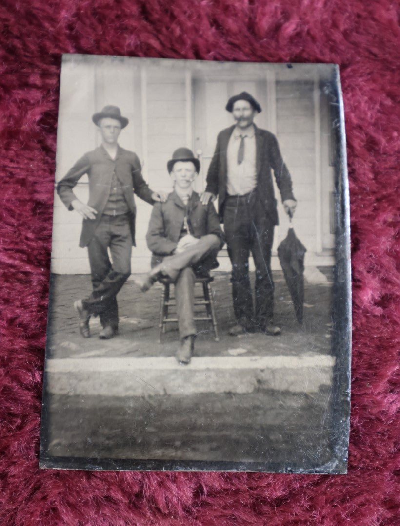 Lot 101 - Tintype Of Three Men Smoking, Holding Umbrella