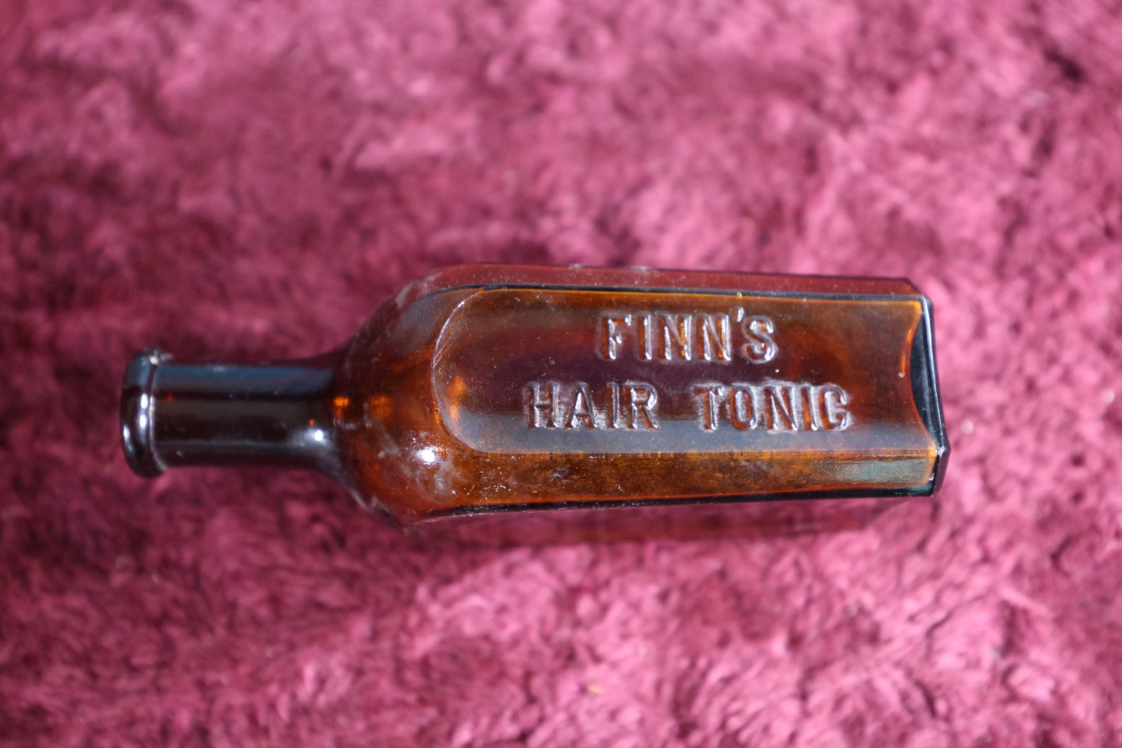 Lot 127 - Finns Hair Tonic Amber Glass Bottle