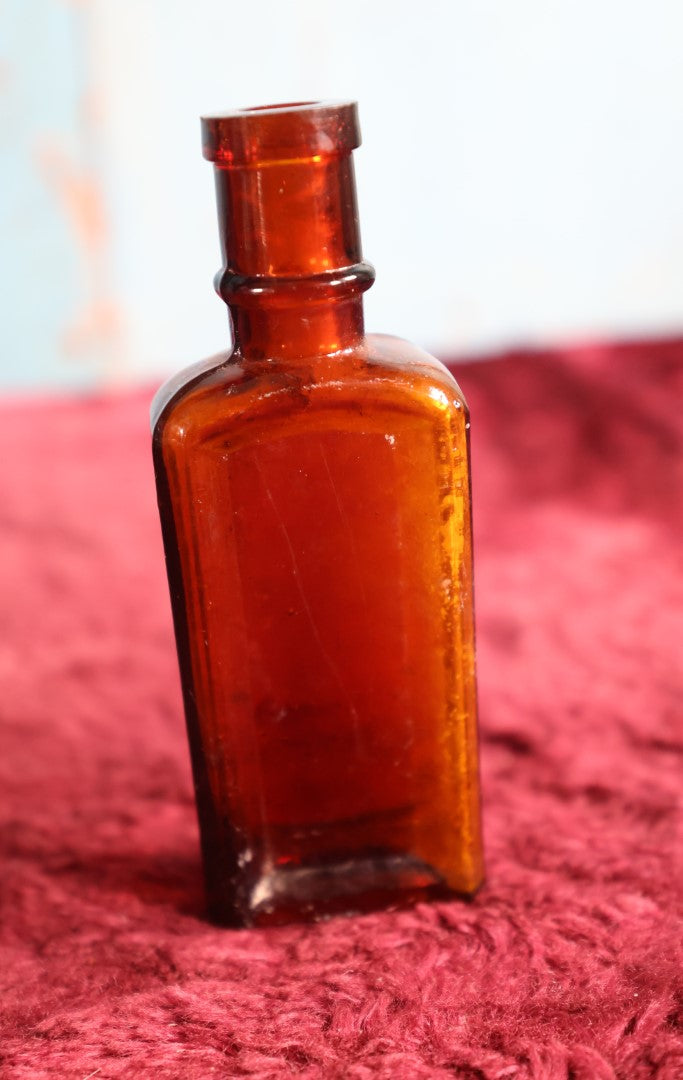 Lot 134 - Antique Amber Glass Whisker Dye Bottle