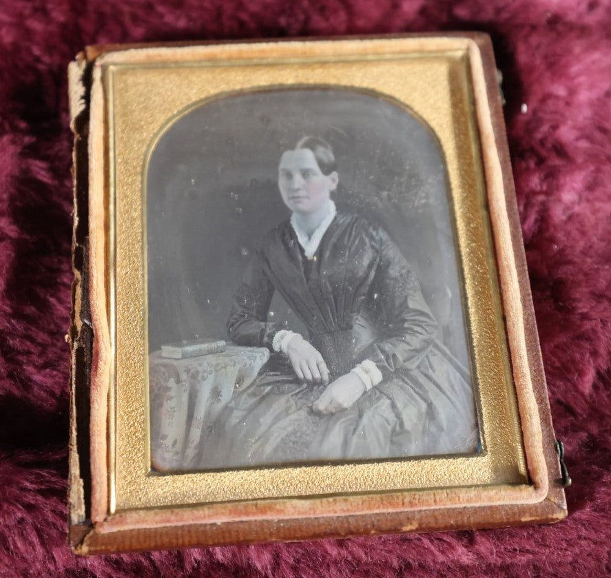 Lot 160 - Quarter Plate Daguerreotype Of Pretty Young Woman In Dress, Book On Table, Nice Half Leatherette Case With Floral Design