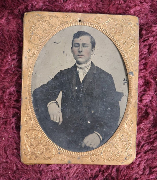 Lot 163 - Quarter Plate Tintype Of Man With Brass Mat, Tinted Lips, Young Adult