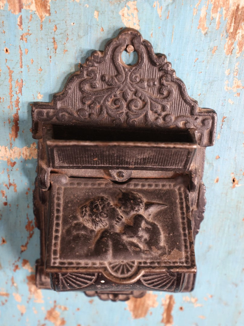 Lot 015 - Antique Venus And Cupid Cast Iron Match Box With Hinged Lid, Match Strike, Marked V.M. Co.