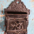 Lot 015 - Antique Venus And Cupid Cast Iron Match Box With Hinged Lid, Match Strike, Marked V.M. Co.