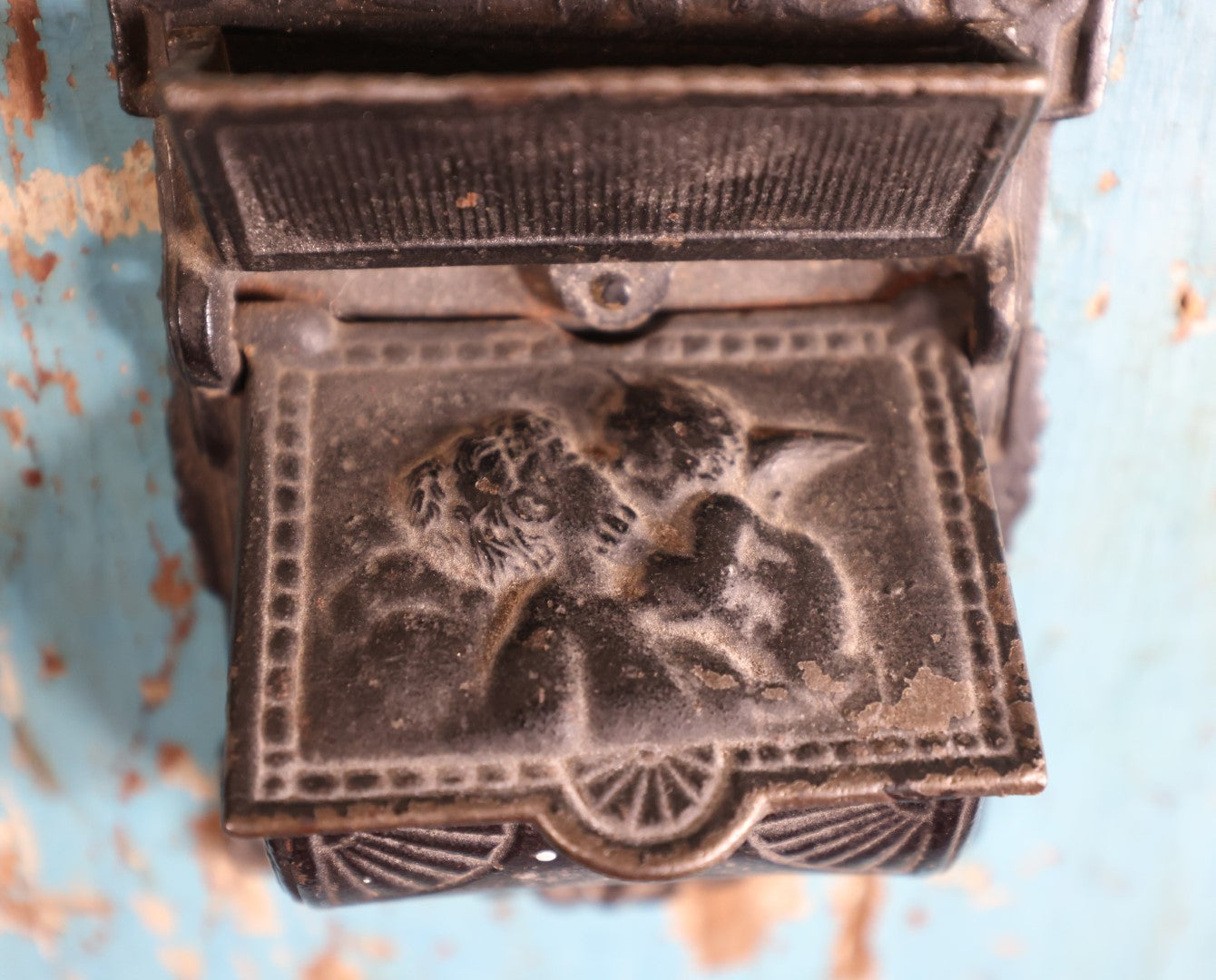 Lot 015 - Antique Venus And Cupid Cast Iron Match Box With Hinged Lid, Match Strike, Marked V.M. Co.