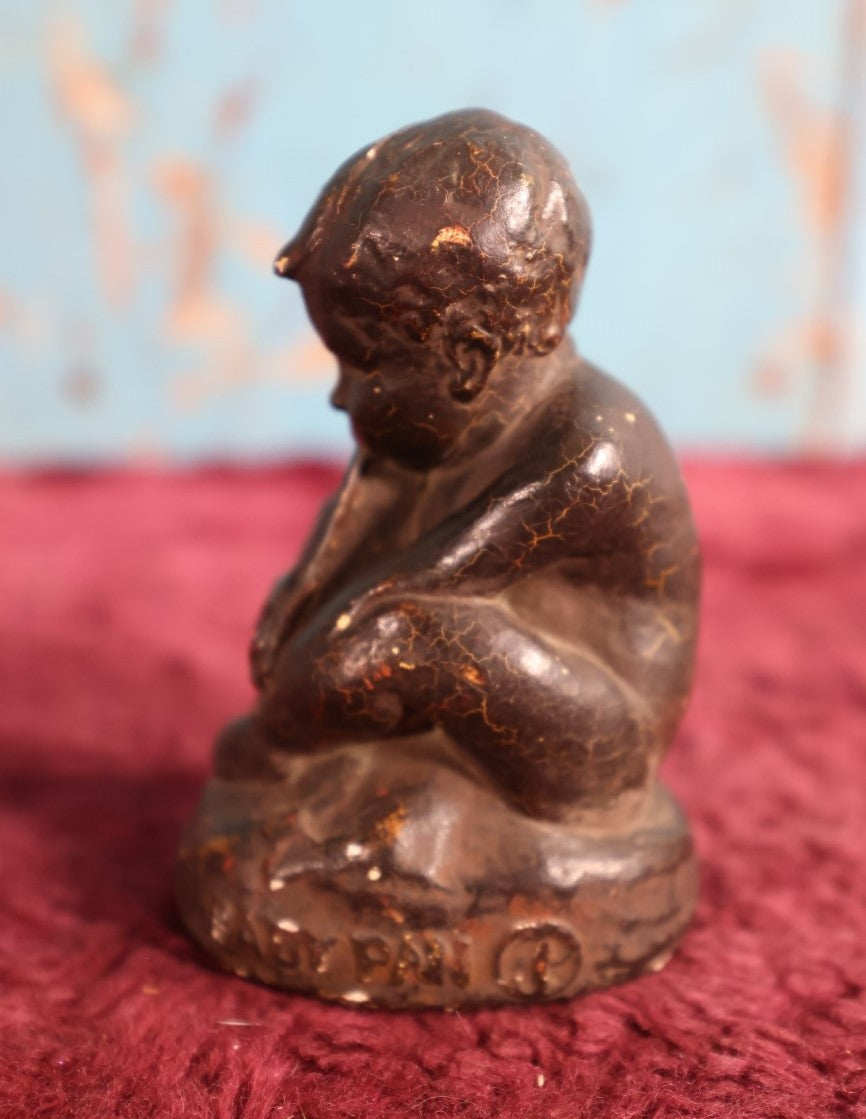 Lot 053 - Antique Chalkware Baby Pan Statue, Dated 1911