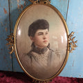 Lot 019 - Antique Colored Portrait Photograph Of Attractive, Well Dressed Young Woman In Ornate Brass Frame With Bubble Glass