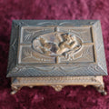 Lot 031 - Antique Pot Metal Match Safe With Cupid Motif, Ornate With Match Strike And Small Box On The Inside, Feet, Etc