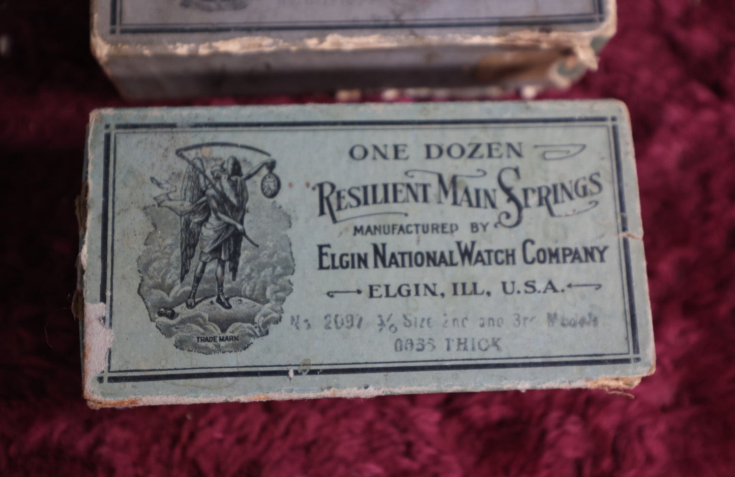 Lot 068 - Pair Of Antique Resilient Main Springs Boxes By The Elgin National Watch Company, Elgin, Illinois, With Father Time, Grim Reeper Motif, With Contents