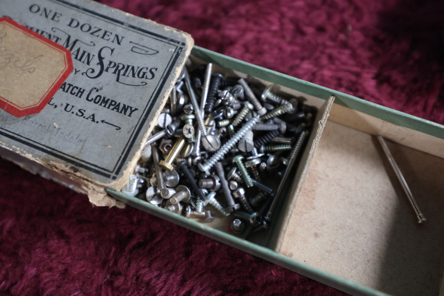 Lot 068 - Pair Of Antique Resilient Main Springs Boxes By The Elgin National Watch Company, Elgin, Illinois, With Father Time, Grim Reeper Motif, With Contents