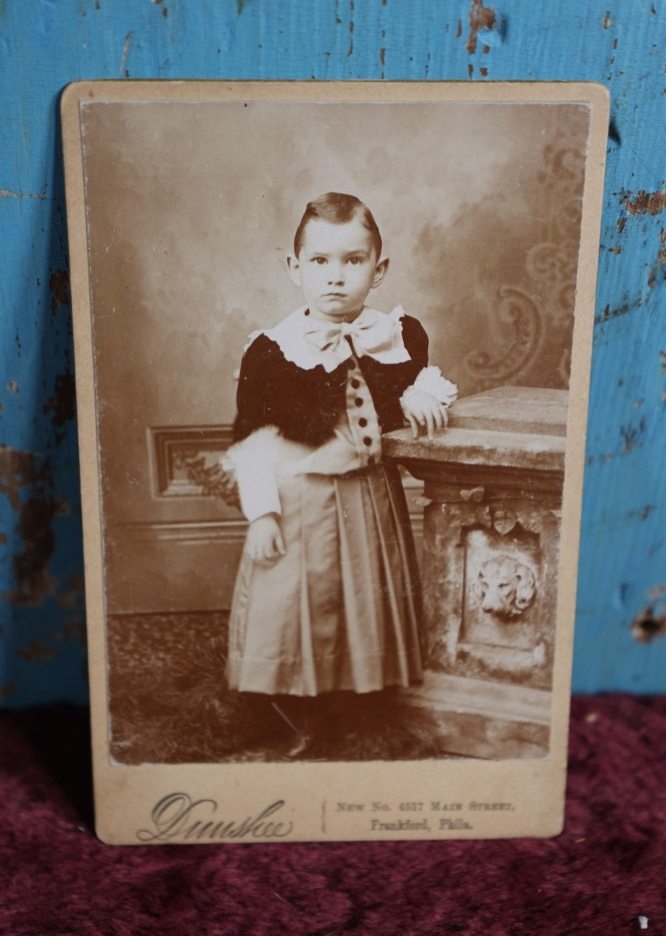 Lot 082 - Antique Cabinet Card Photo Of Young Child, Well Dressed, Against Pedestal With Carved Dog Head, Dunshee Photographer, Frankford, Pennsylvania