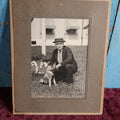 Lot 084 - Antique Boarded Photo Of Man In Hat With German Shepherd Puppy