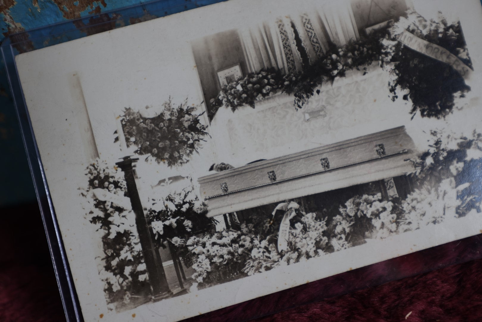 Lot 086 - Antique Real Photo Postcard Rppc Of Man In Coffin, Flower Wreath Says Pillow Workers (?)