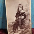 Lot 093 - Antique Midwestern Cabinet Card Photo Of Young Girl Holding Rifle, Photographed By Shelton Portrairs, St Louis, Missouri