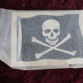 Lot 102 - Vintage Skull Jolly Roger Flag Window Or Luggage Aplique, By Baxter Lane Co., Amarillo, Texas